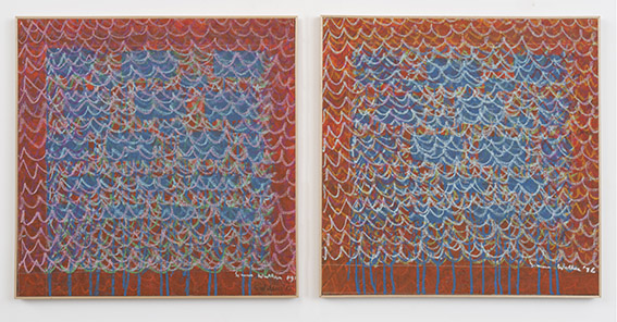 Two framed abstract paintings side by side: orange-red canvases with blue scalloped shapes and white drips descending from the top edge. Two-panel abstract art with red backgrounds, blue cloud-like forms, and white scalloped lines dripping downward.