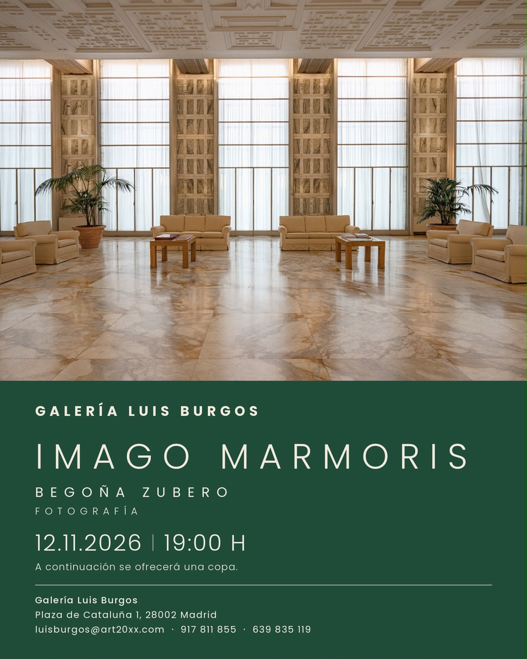 Lobby-style gallery space with beige sofas, tall windows, and plants; a green information panel displays 'GALERÍA LUIS BURGOS IMAGO MARMORIS' and the event details (12.11.2026 | 19:00 H).